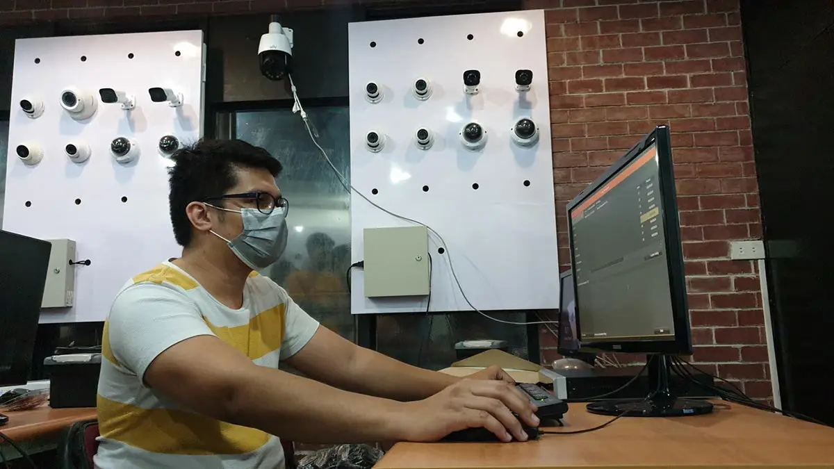 A student at Inventive Media configuring security surveillance software during a hands-on CCTV training session in the Philippines